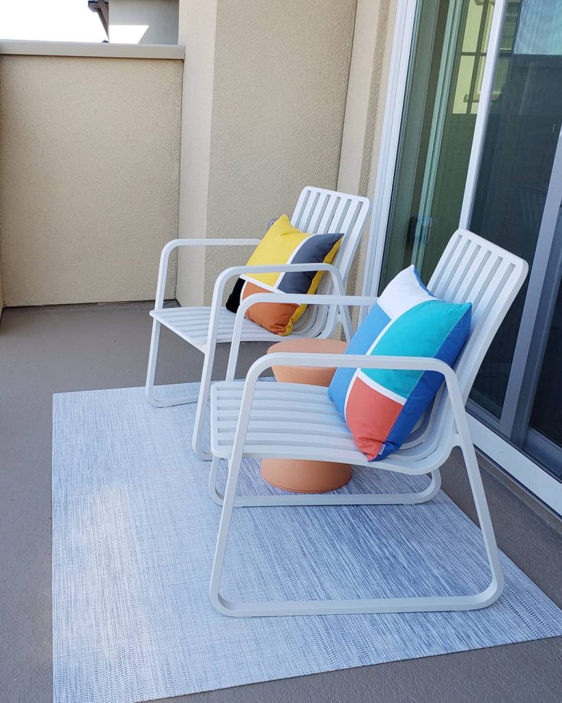 Easy maintenance outdoor chairs outside master bedroom