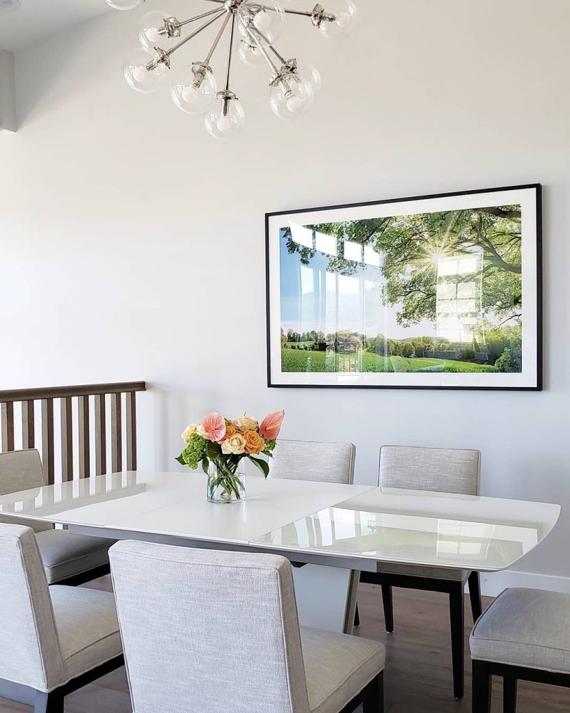 Chandelier over dining table in modern dining space